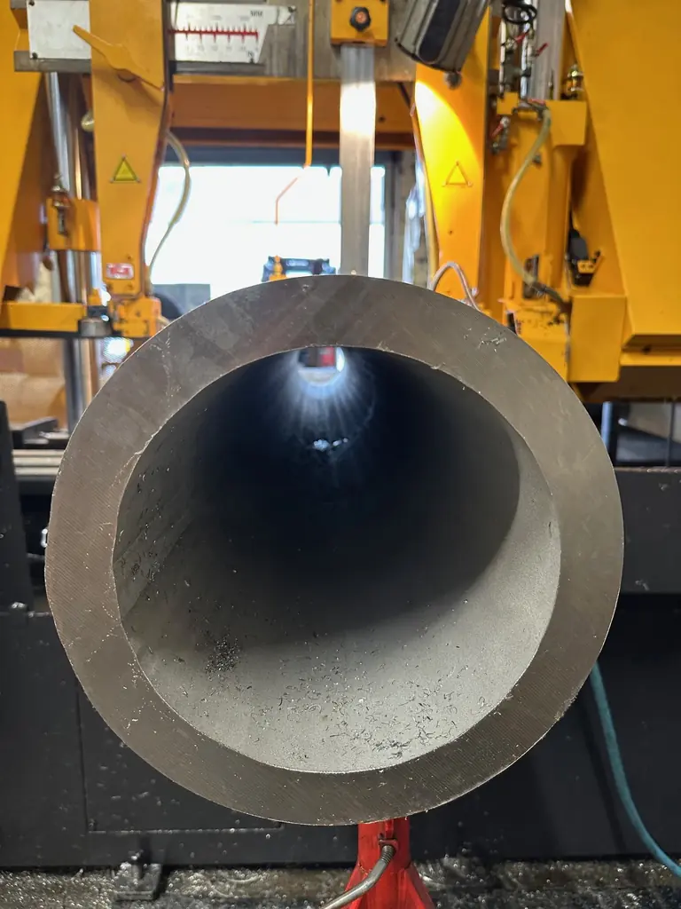 Home 2 Large stainless steel pipe positioned on cutting machine