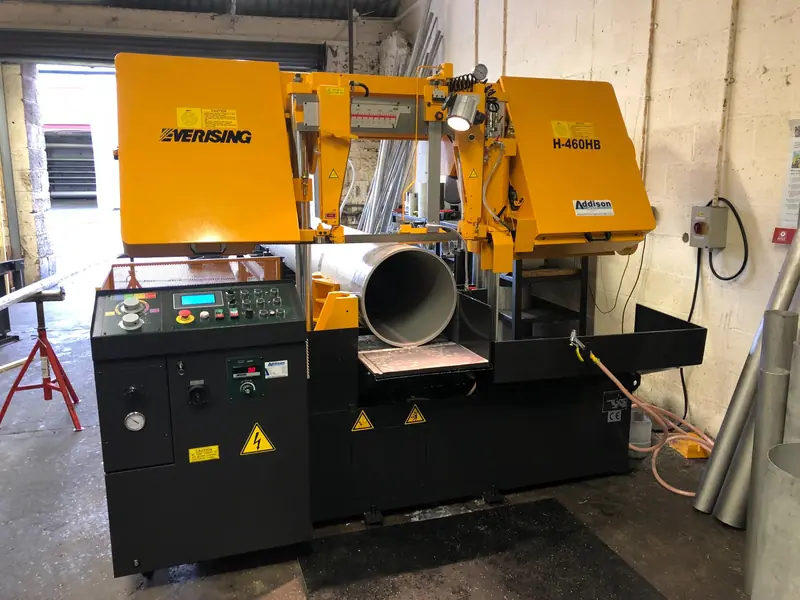 Home 1 Large stainless steel pipe positioned on cutting machine