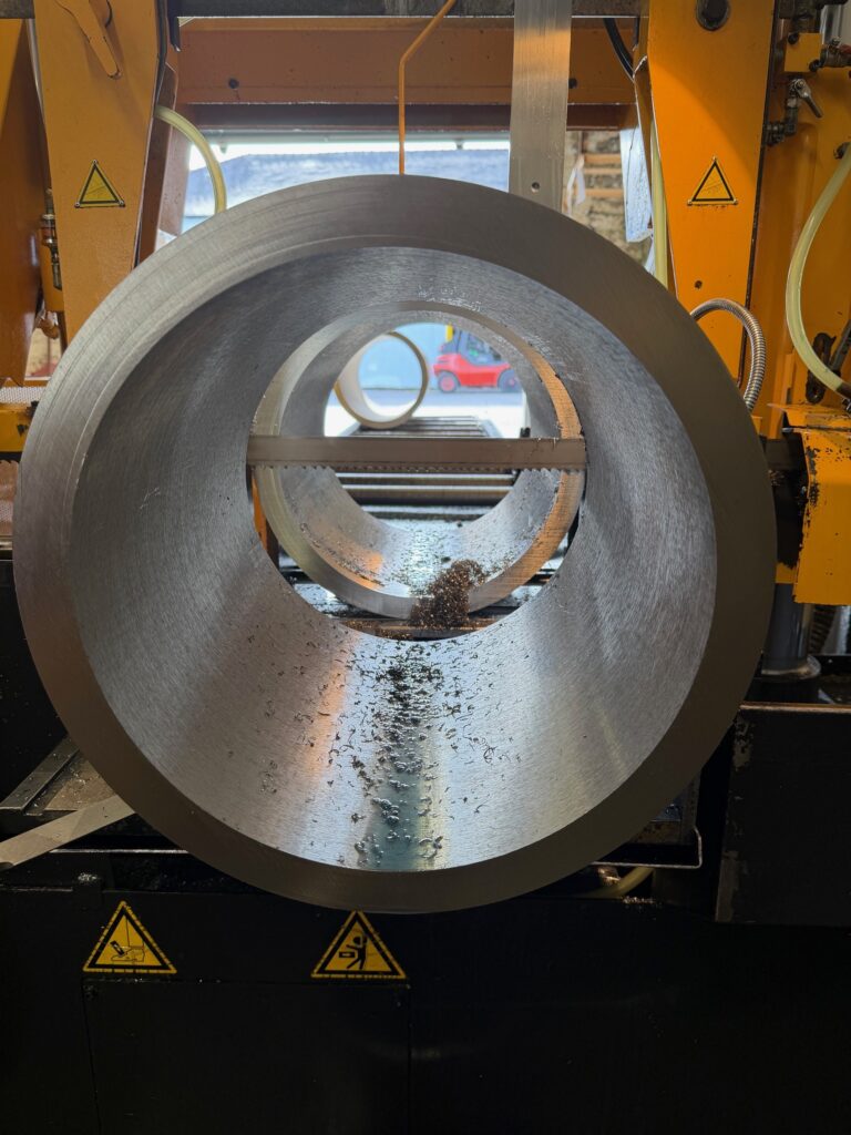 A312 Seamless Pipe 1 Thick-wall seamless stainless steel pipe on the bandsaw, end view